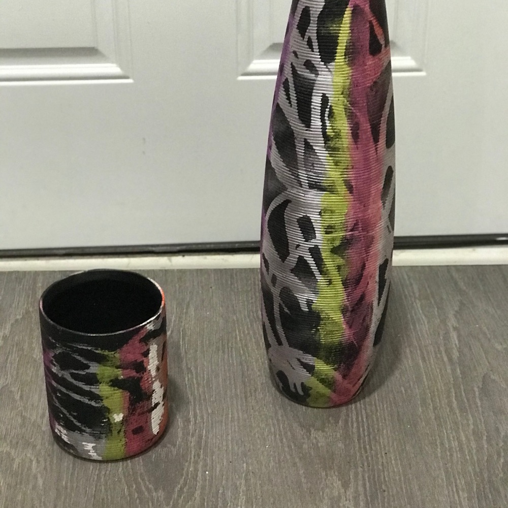 A set-multi-colored fluorescent ceramic vases uses, various techniques to color.